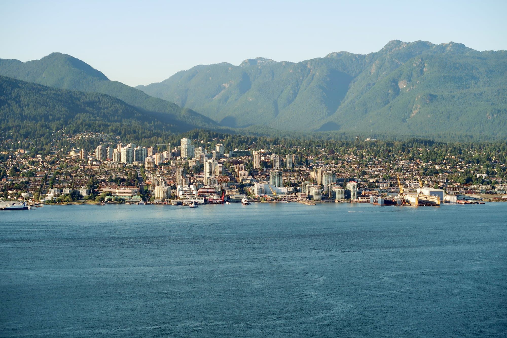 The North Shore of Burrard Inlet with the city of North Vancouver in the foreground and the Coast Mountains rising behind.