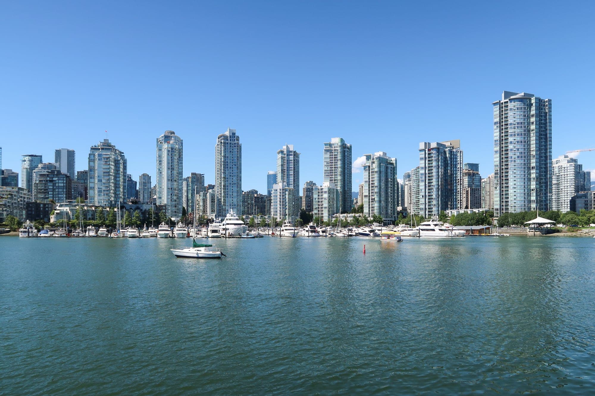 Yaletown condominium towers and seawall in downtown Vancouver along False Creek.