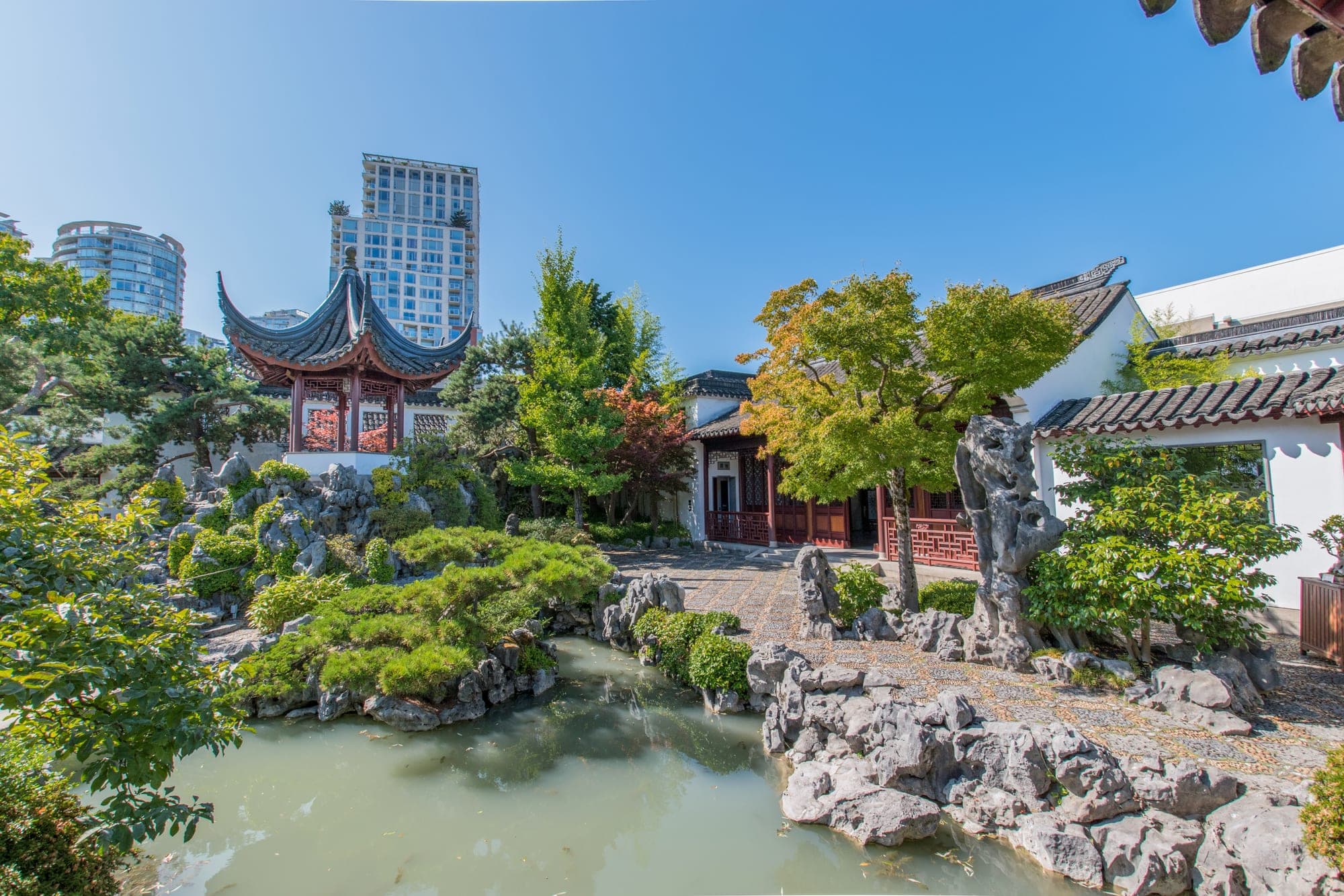 A traditional Chinese pavilion reflected in a still pond at the Dr. Sun Yat-Sen Classical Chinese Garden in Vancouver's Chinatown.